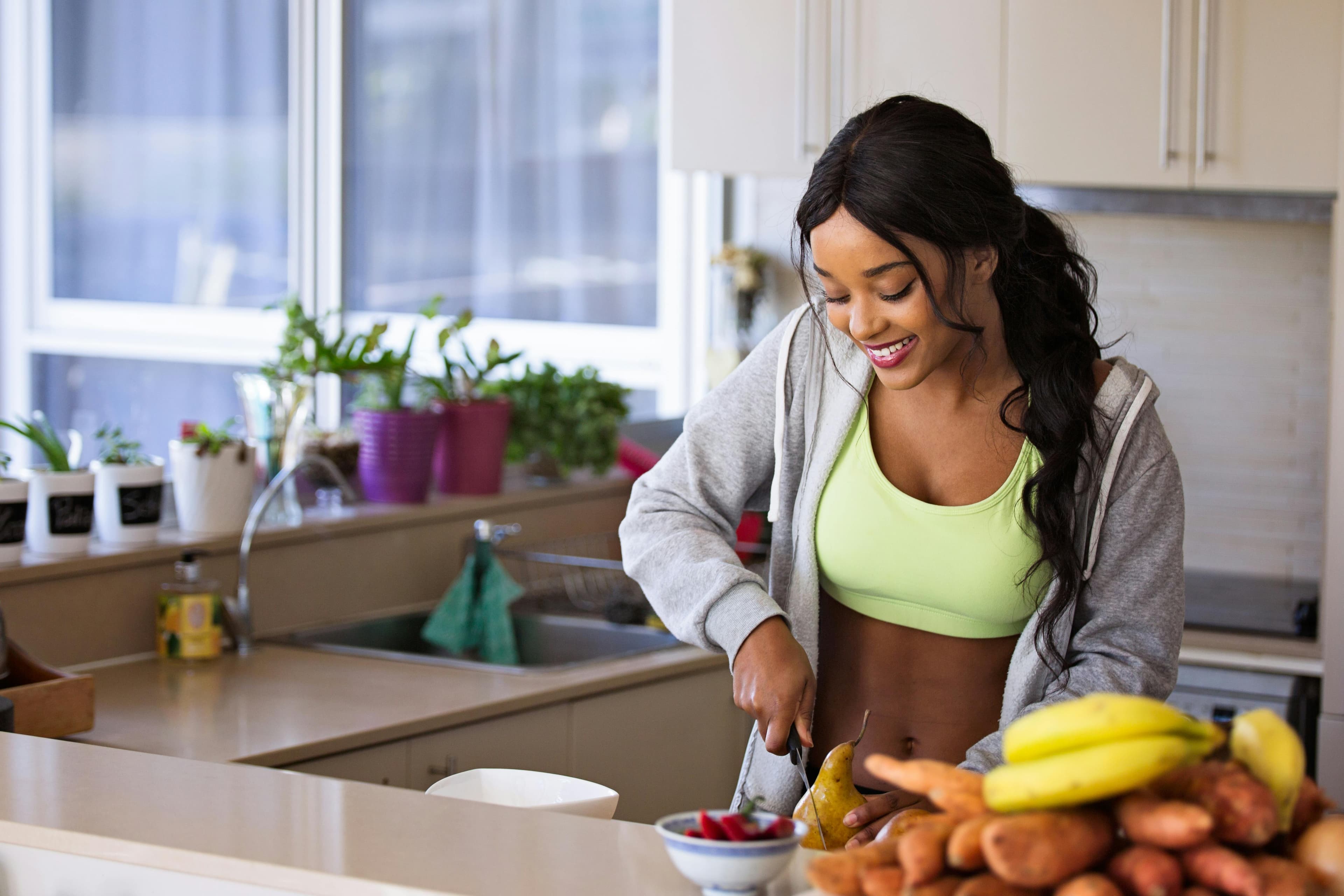 College students preparing healthy meals together in shared kitchen
