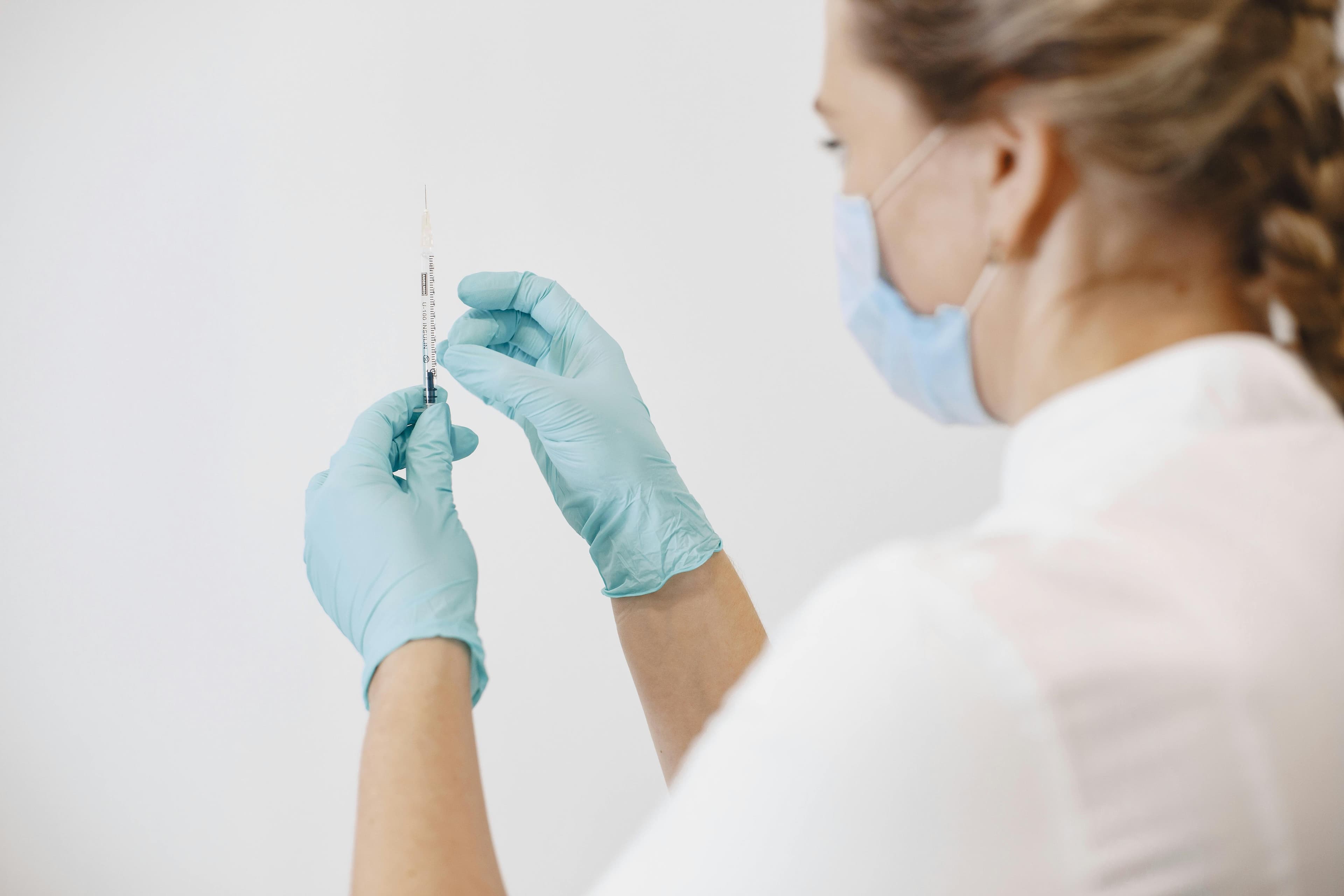 Happy couple holding pregnancy test showing positive result