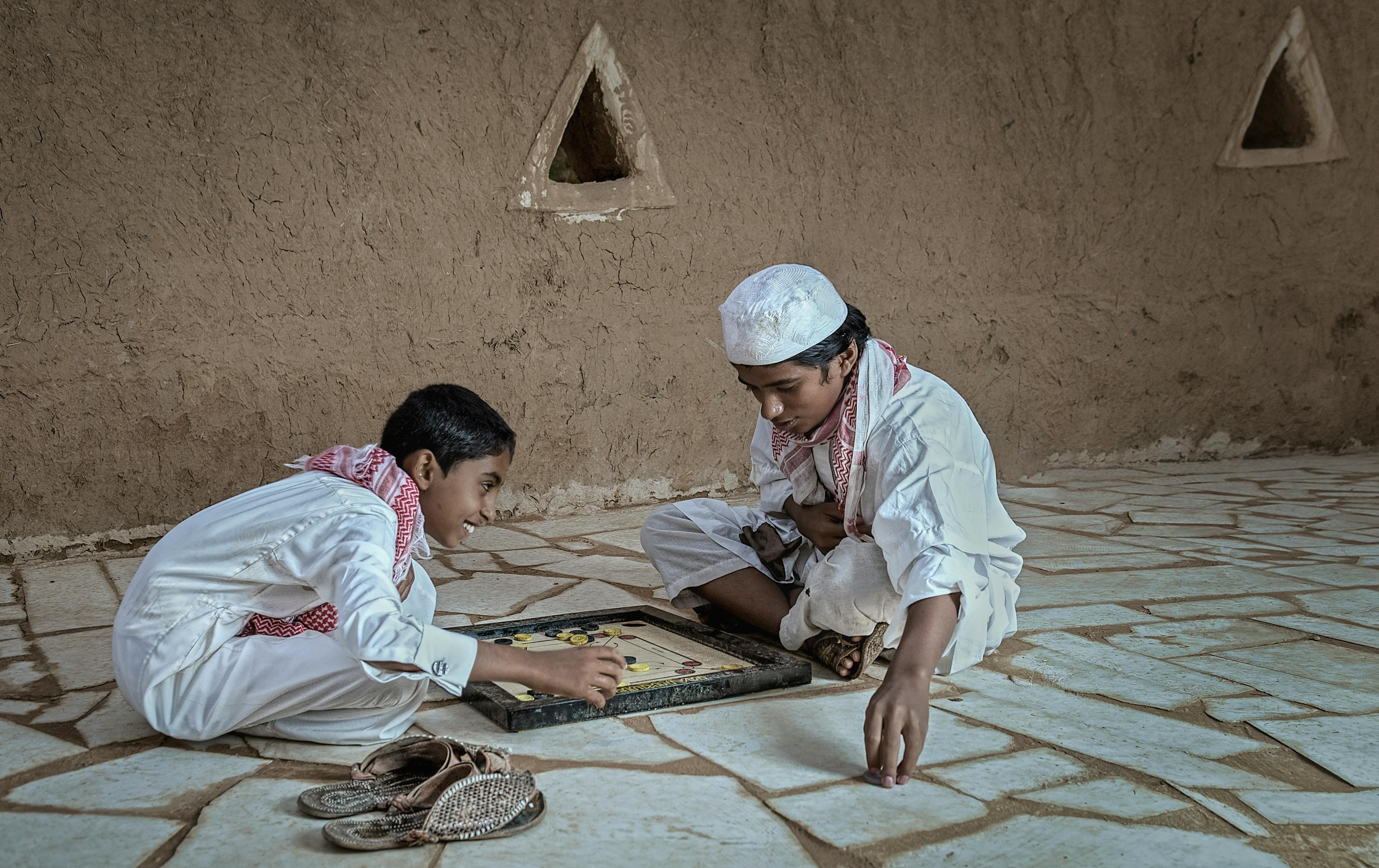 Dermatologist explaining facial anatomy and volume loss prevention to patient