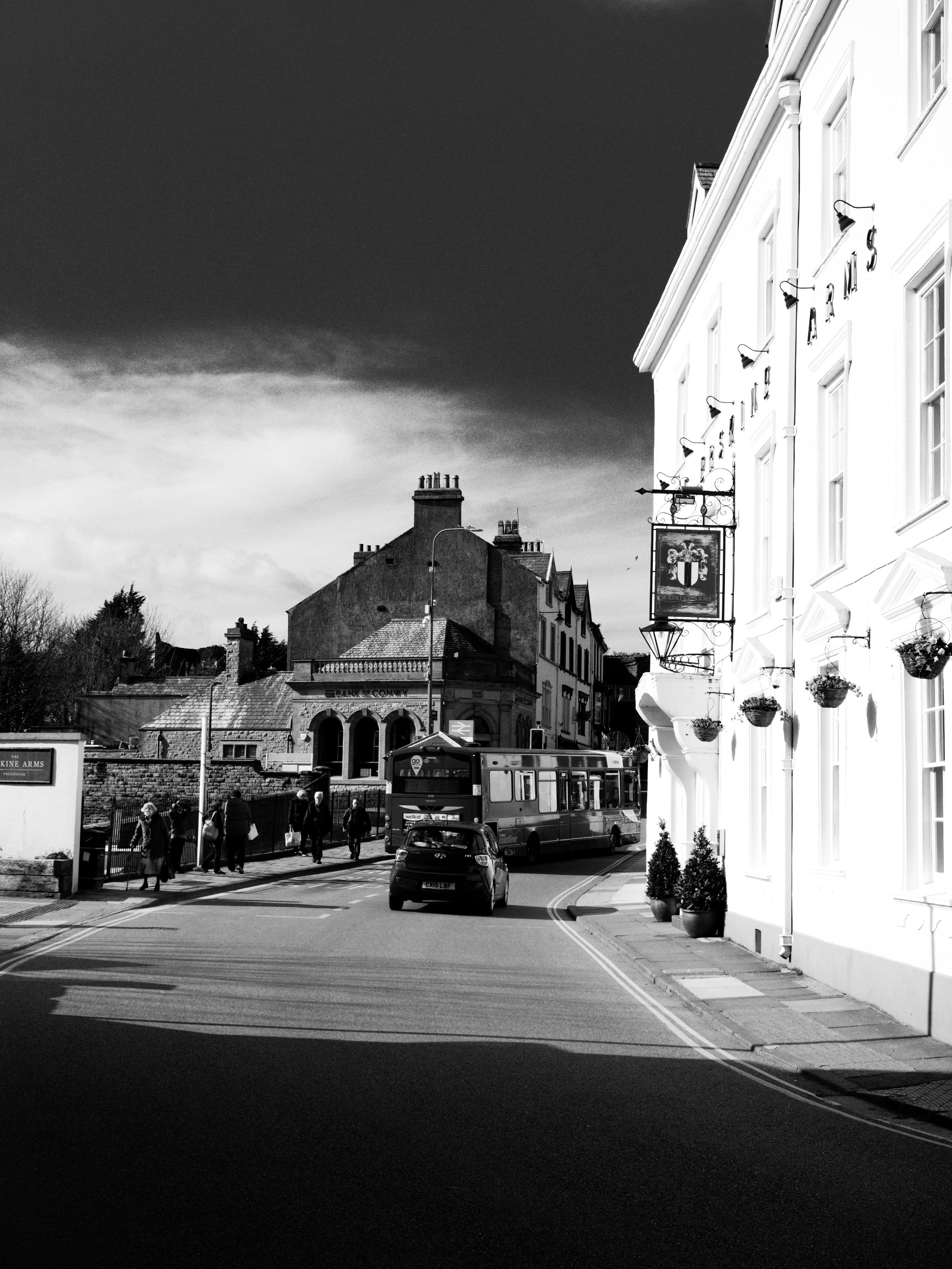 Person writing in journal with healthy foods nearby, representing emotional awareness and recovery